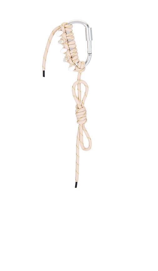 8 other reasons carabiner bag charm in metallic gold.