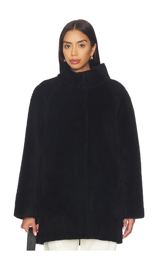 aexae shearling high neck mid length jacket in black.
