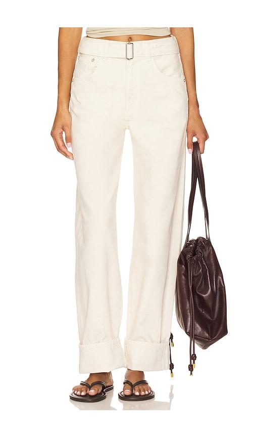 agolde cuffed taper jeans in ivory.