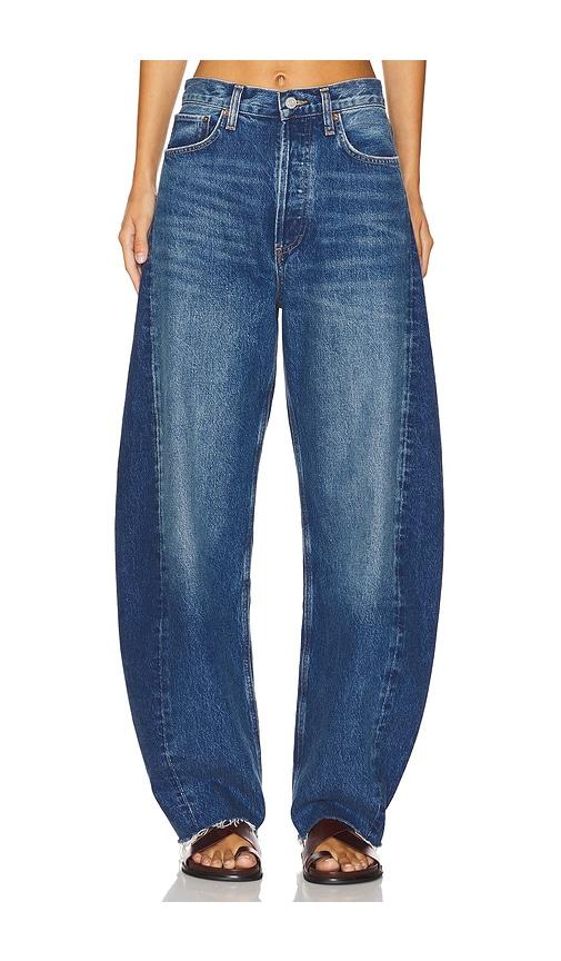 agolde luna pieced high rise curved taper jeans in denim-medium.