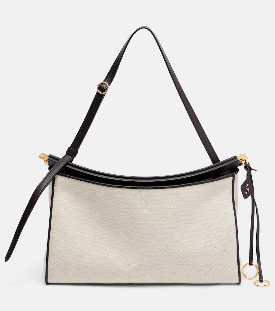 alaïa le click pocket large canvas tote bag