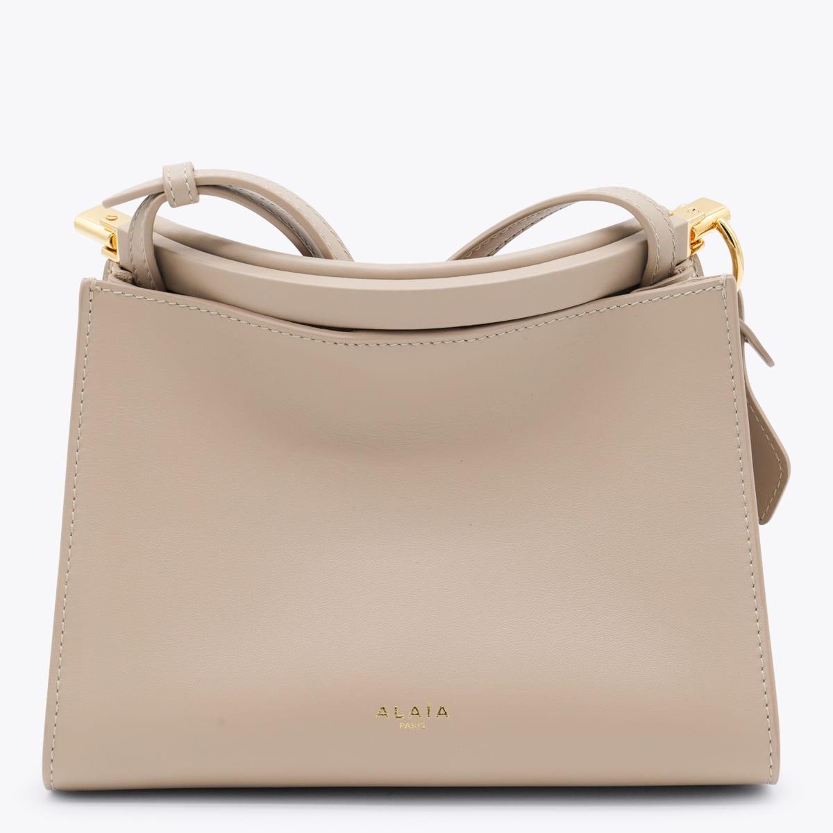 alaia beige leather small square crossbody bag