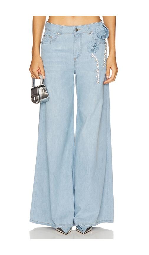 area crystal rosette wide leg jeans in blue.