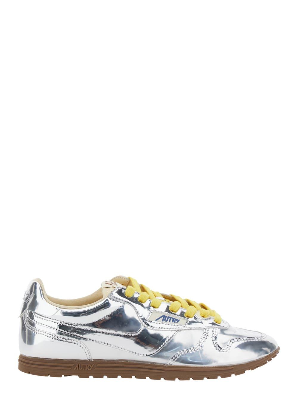 autry windspin low silver colored sneaker with logo on the side in shiny fabric woman