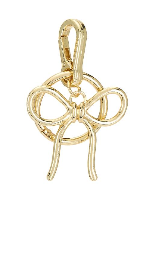 baublebar bow bag charm in metallic gold.