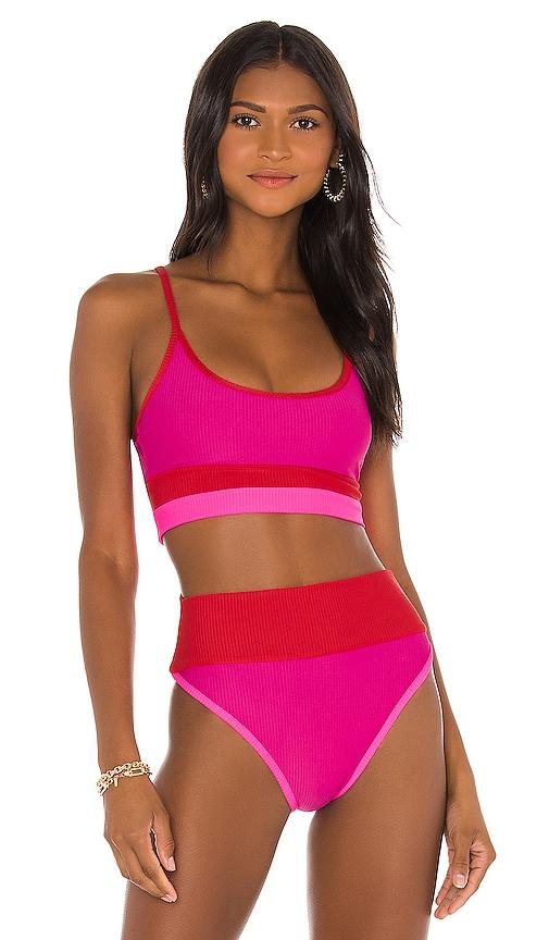 beach riot eva bikini top in fuchsia.