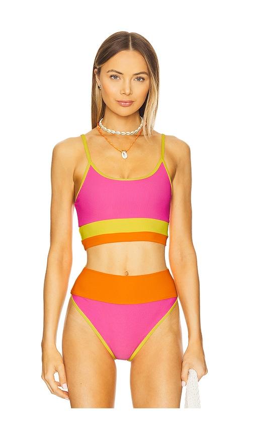 beach riot eva bikini top in pink.