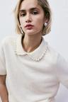 beaded-collar knit top