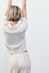 beaded-collar knit top