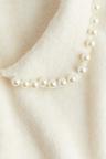 beaded-collar knit top