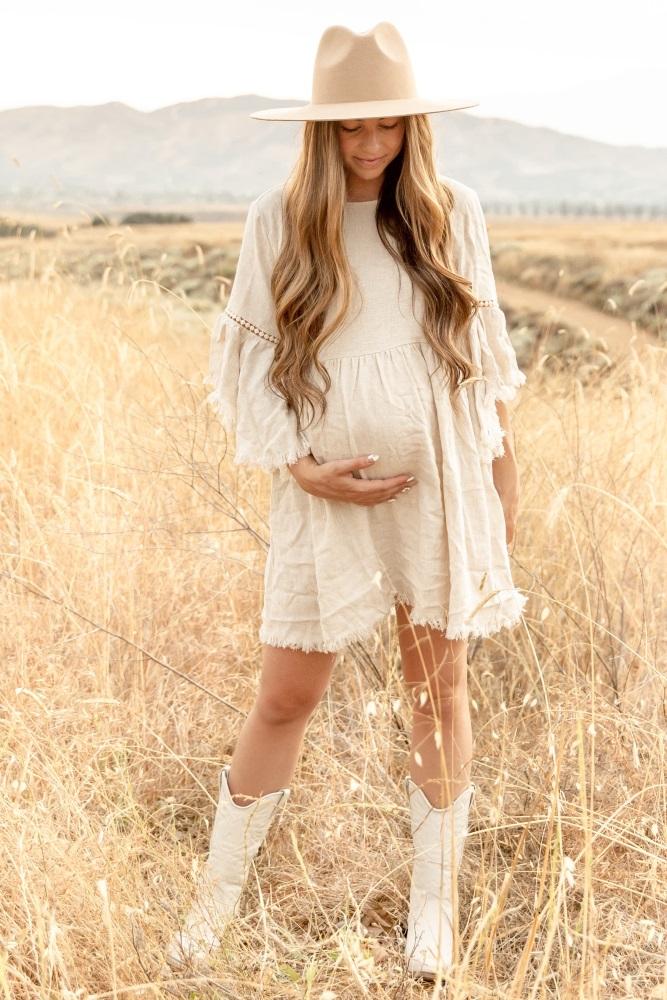 beige raw edge bell sleeve babydoll maternity dress