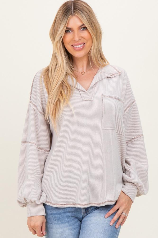 beige solid ribbed long sleeve pocketed collared v-neck top