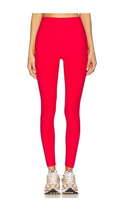 beyond yoga spacedye caught in the midi high waist leggings in red.
