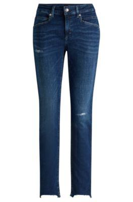 blue jeans in distressed stretch denim with frayed hems- dark blue women's jeans