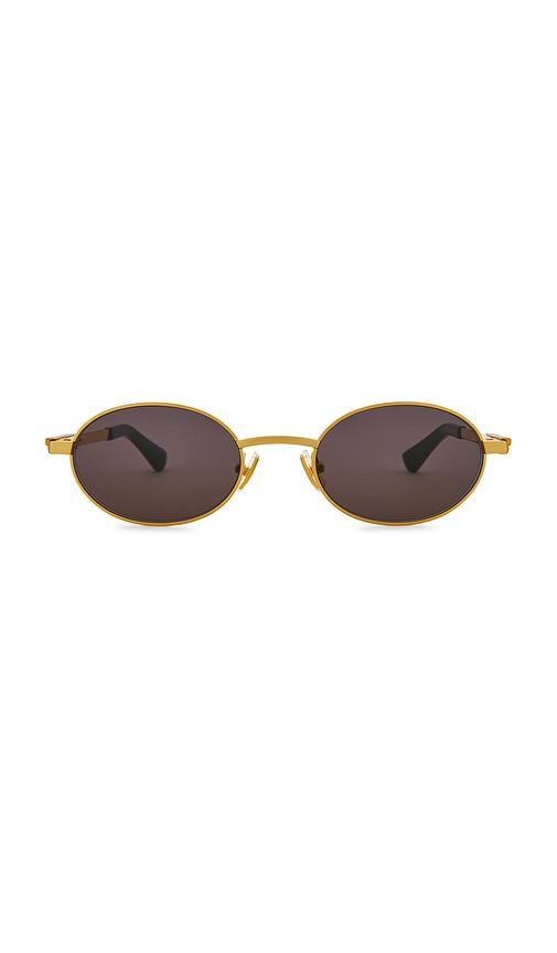 bottega veneta oval sunglasses in metallic gold.