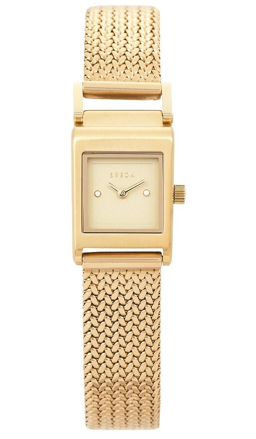 breda revel tethered watch in metallic gold.