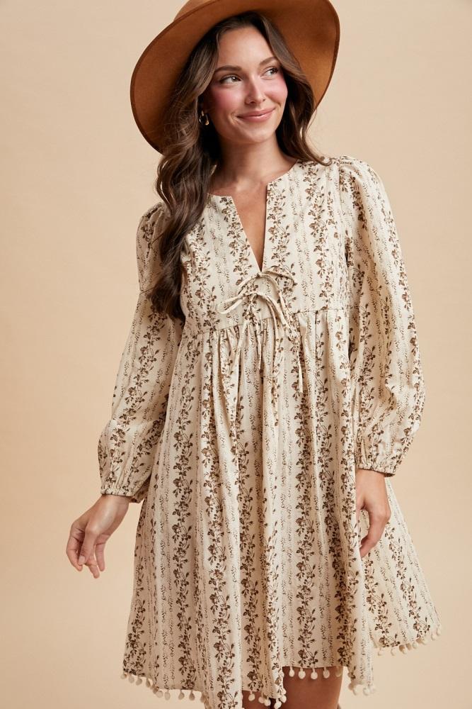 brown floral pom accent hem long sleeve dress