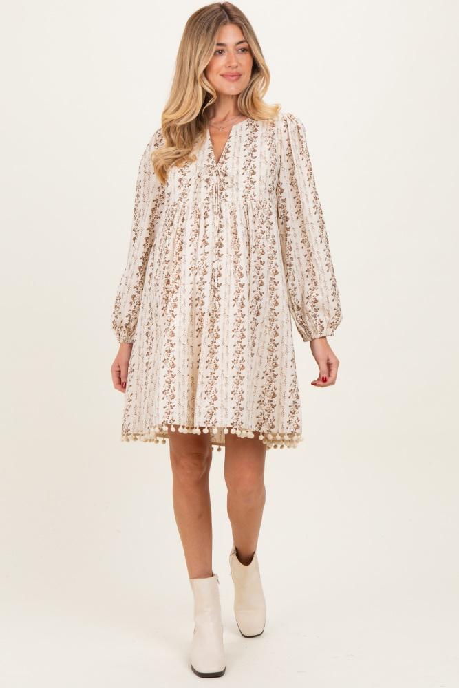 brown floral pom accent hem long sleeve maternity dress