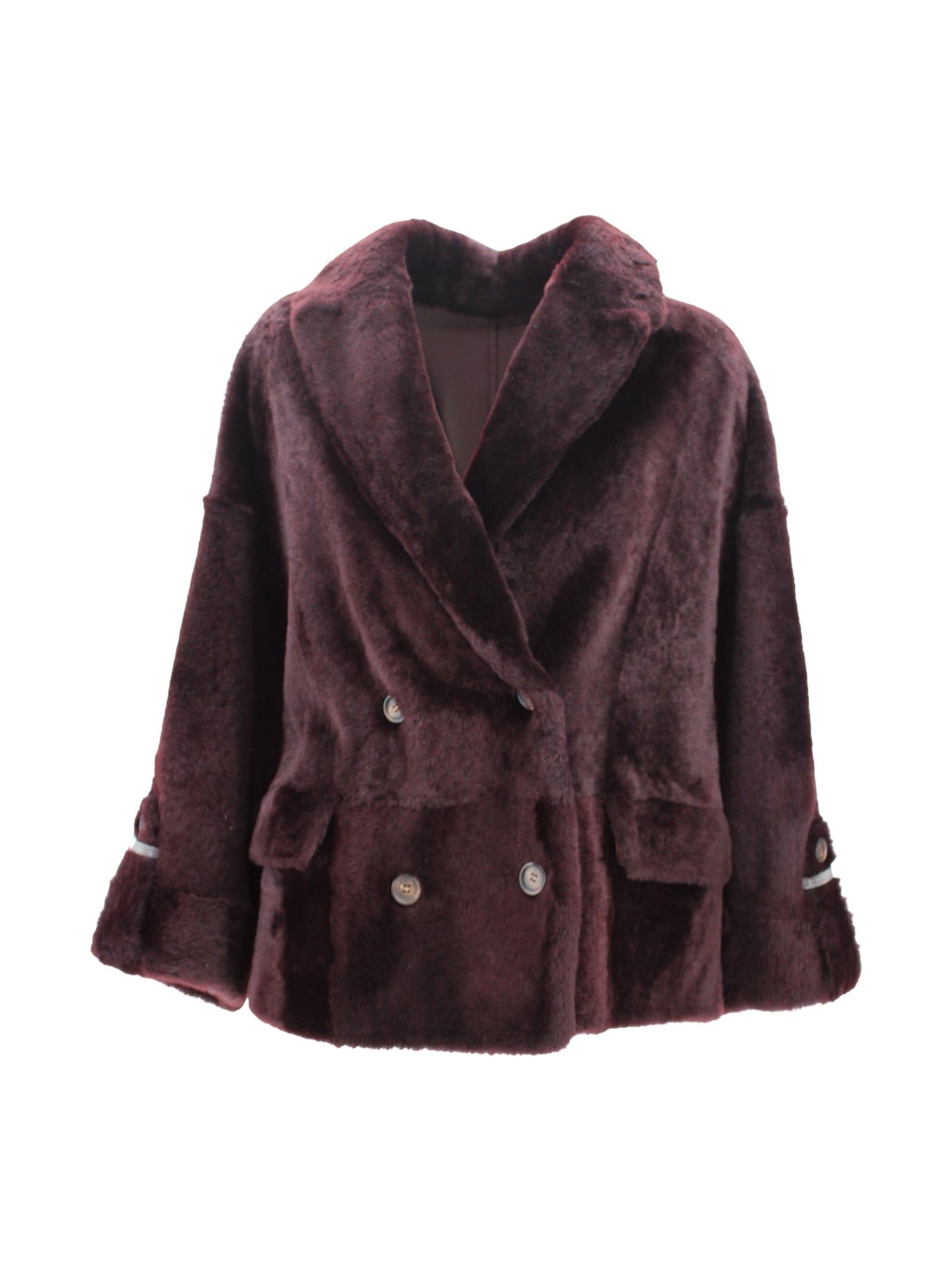 brunello cucinelli reversible shearling outerwear with shiny cuff details.