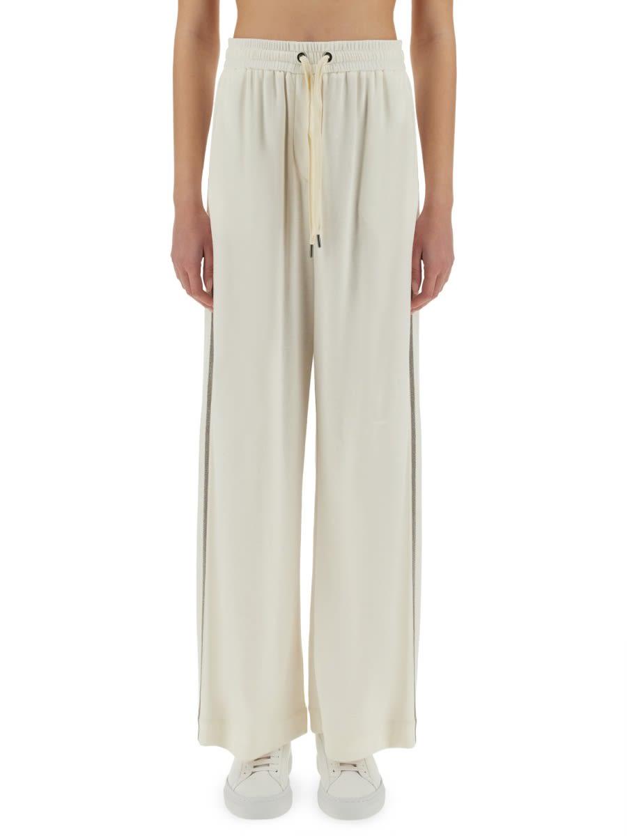 brunello cucinelli track pants with necklace