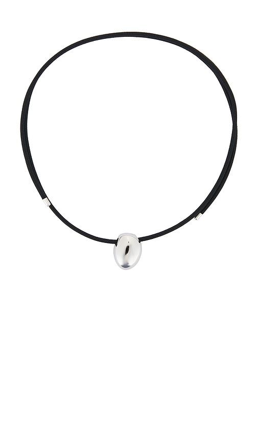 cendre jean necklace in metallic silver.