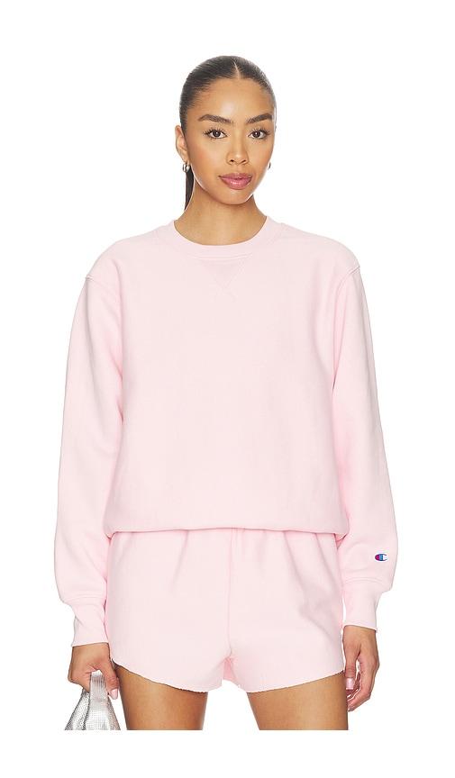 champion reverse weave crewneck sweater in rose.
