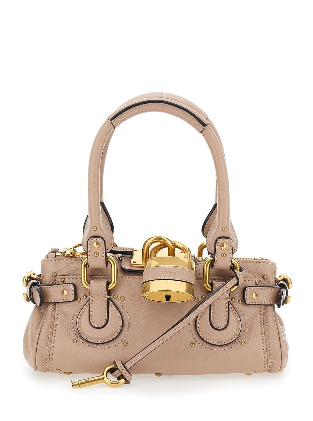 chloé paddington pink handbag with lock on the front and two top handles in leather for women