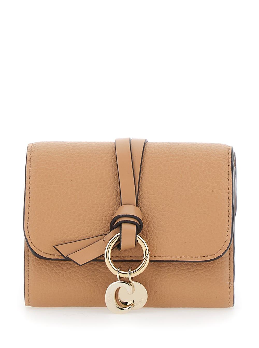 chloé small tri-fold wallet with charm on the front and magnetic closure in beige leather for women
