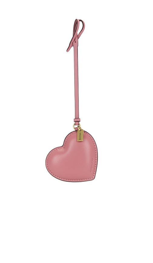 coach heart puffy bag charm in mauve.