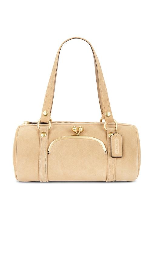 coach originals suede kisslock barrel bag in beige.