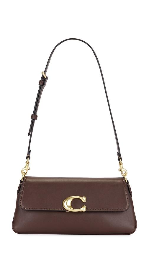 coach refined calf leather jet bag in brown.