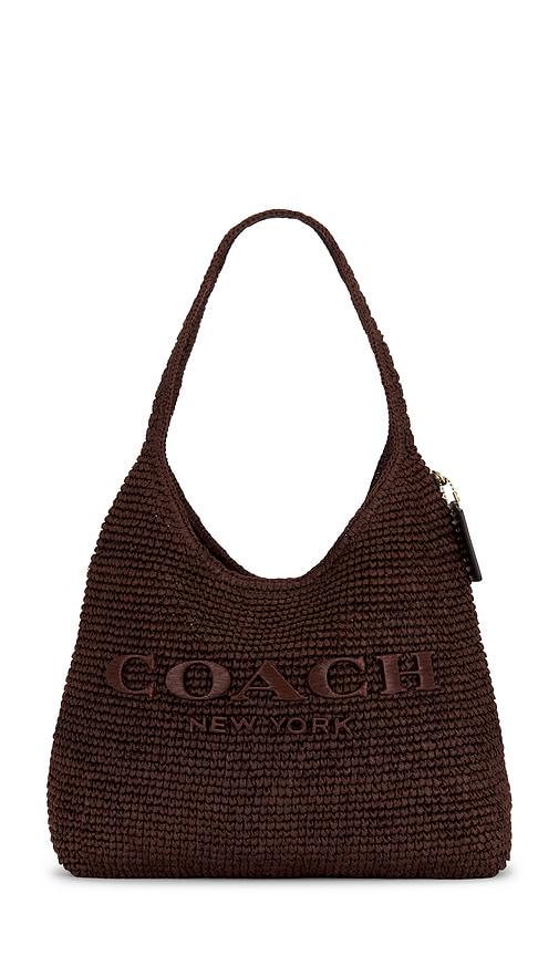 coach refined weave straw brooklyn 34 shoulder bag in mauve.