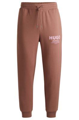 cotton-terry tracksuit bottoms with logo print- brown men's jogging pants