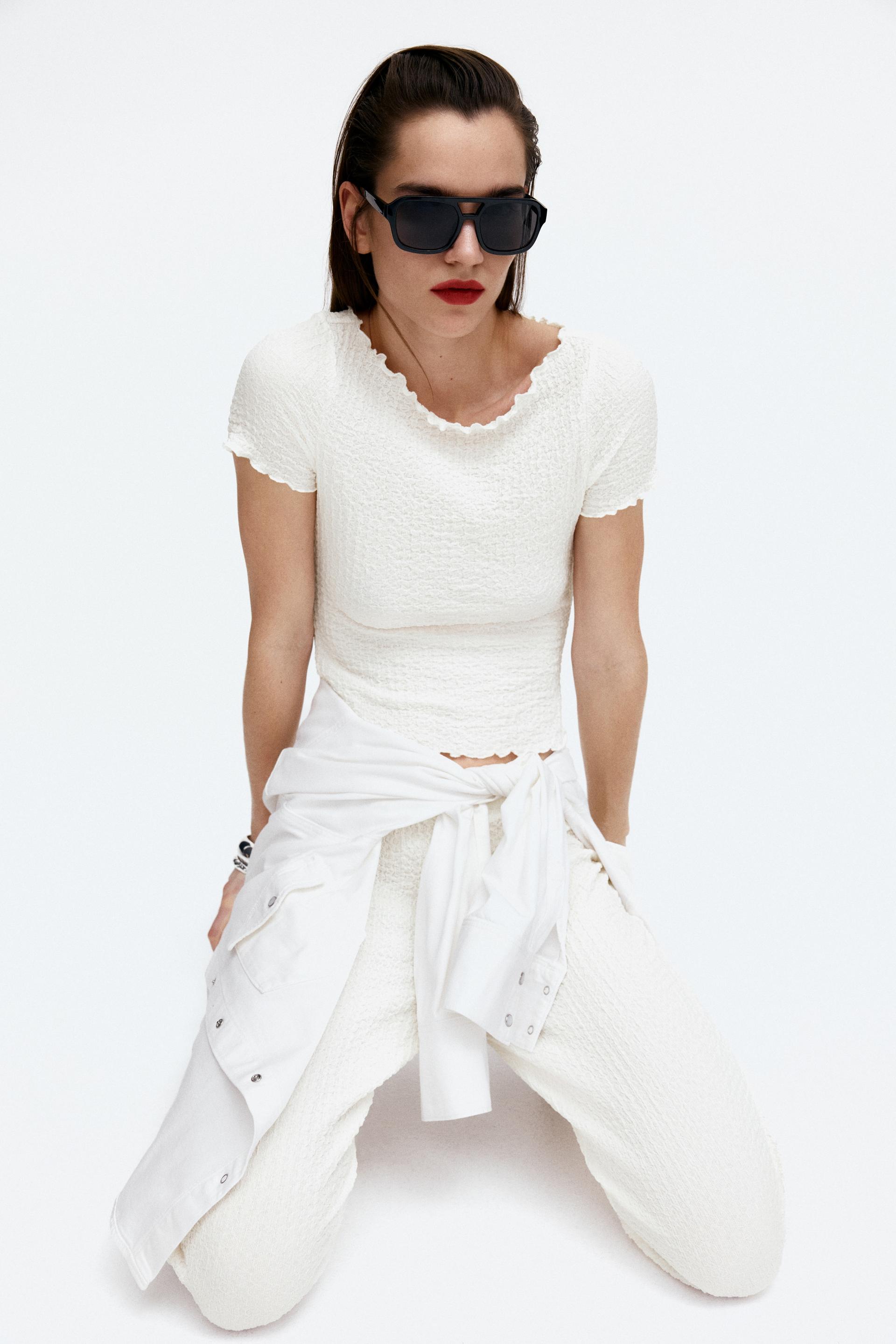 crinkled top with overlocked trim