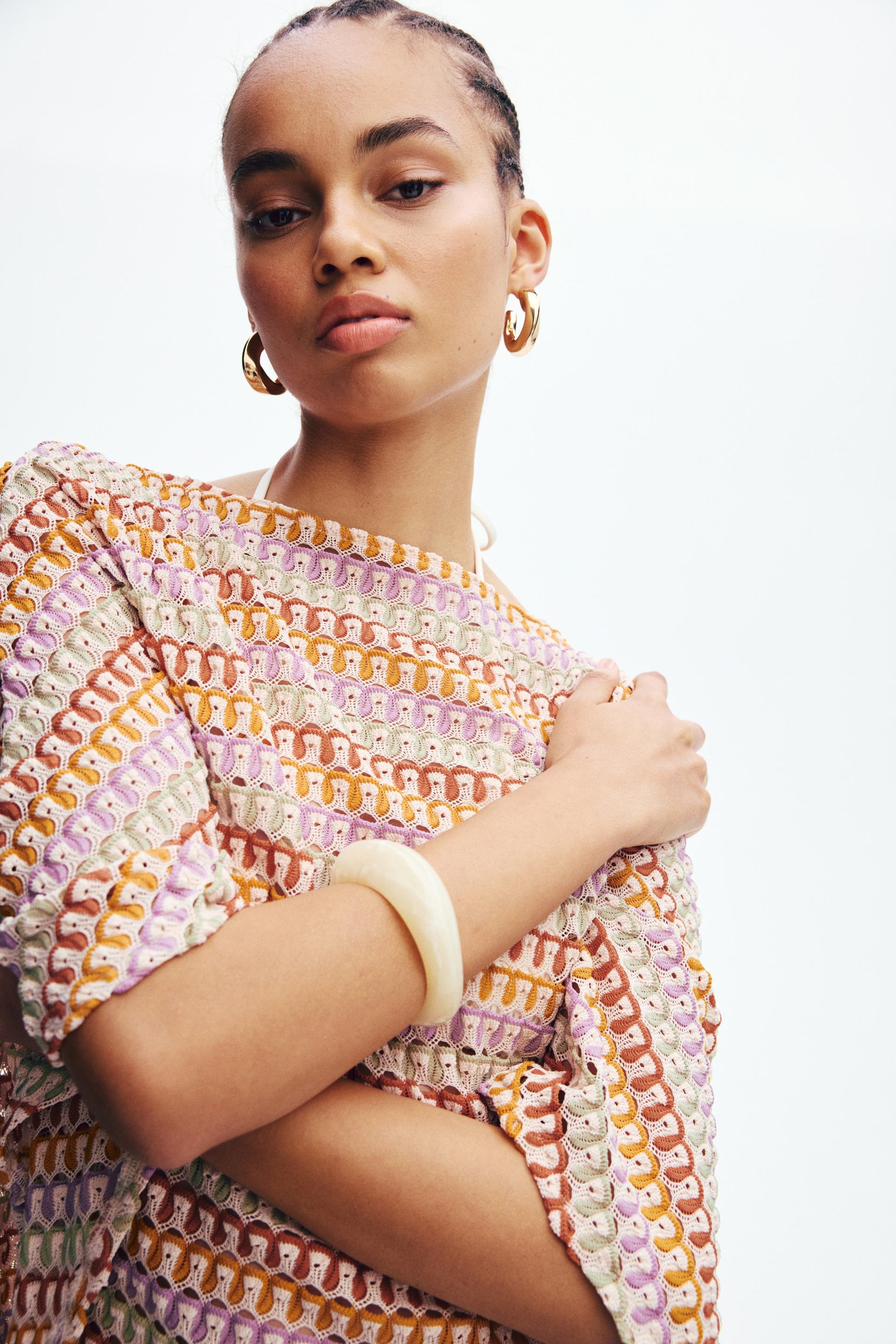 crochet-look cape top