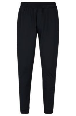cuffed tracksuit bottoms in active-stretch fabric- black men's jogging pants