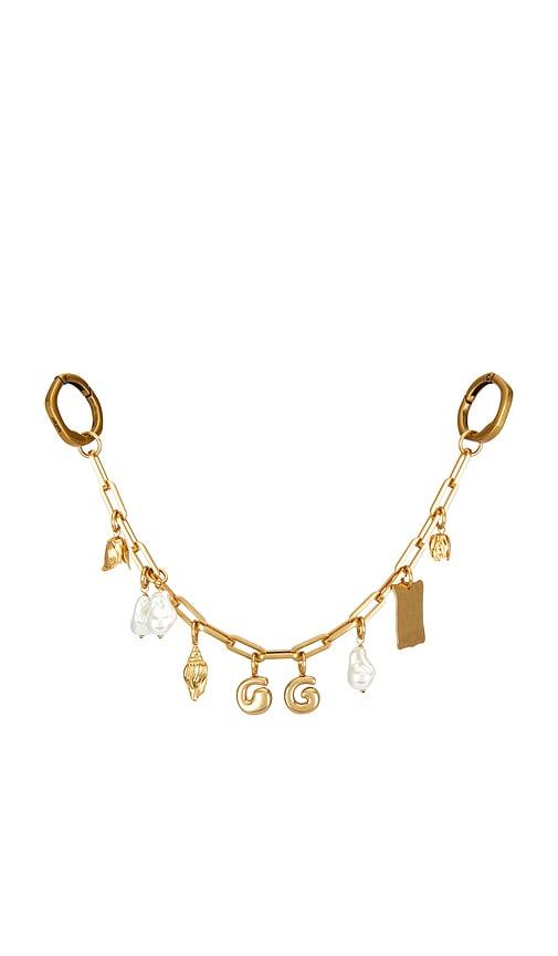 cult gaia bijou bag charm in metallic gold.