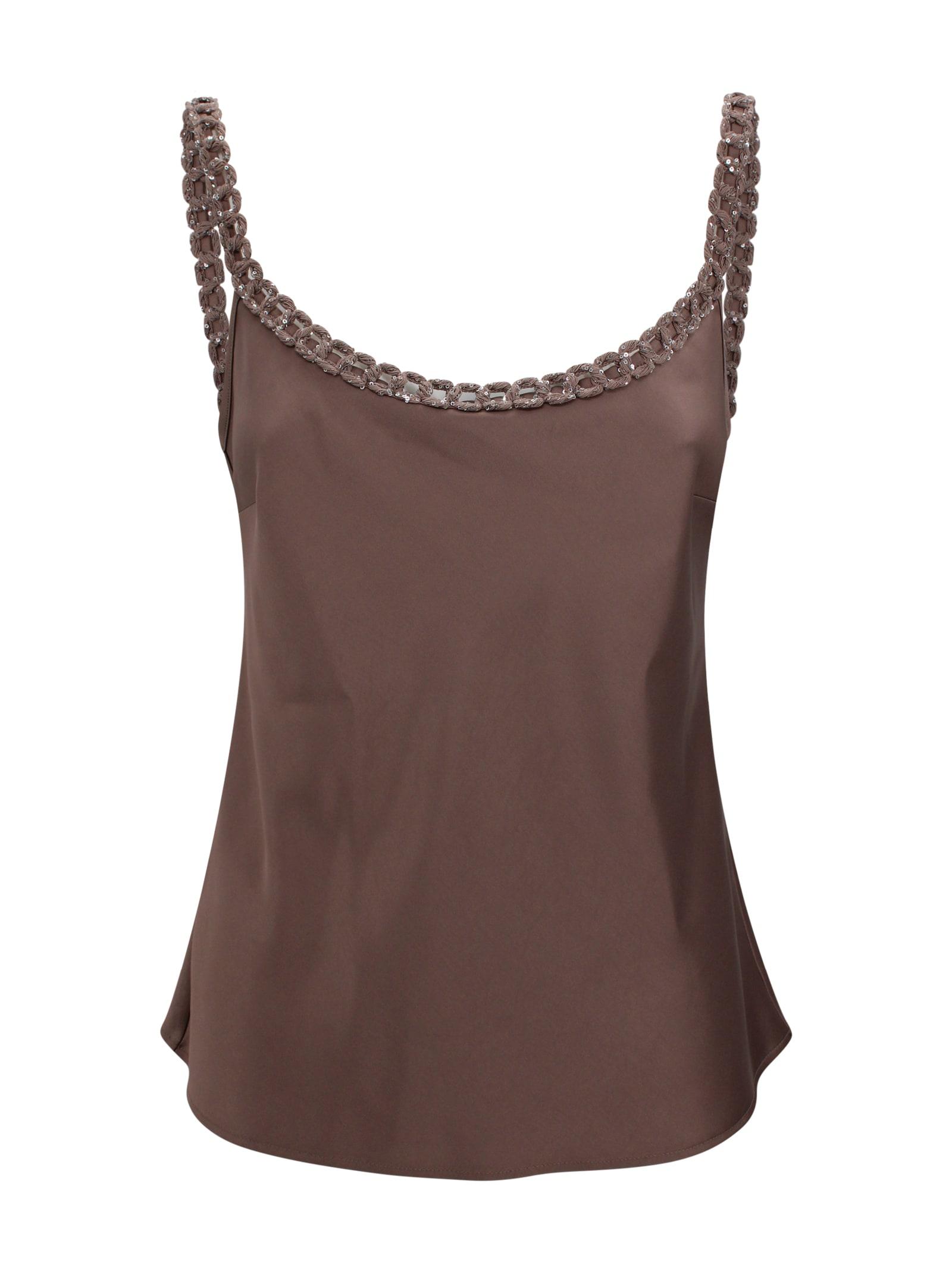 d. exterior decorated sleeveless top