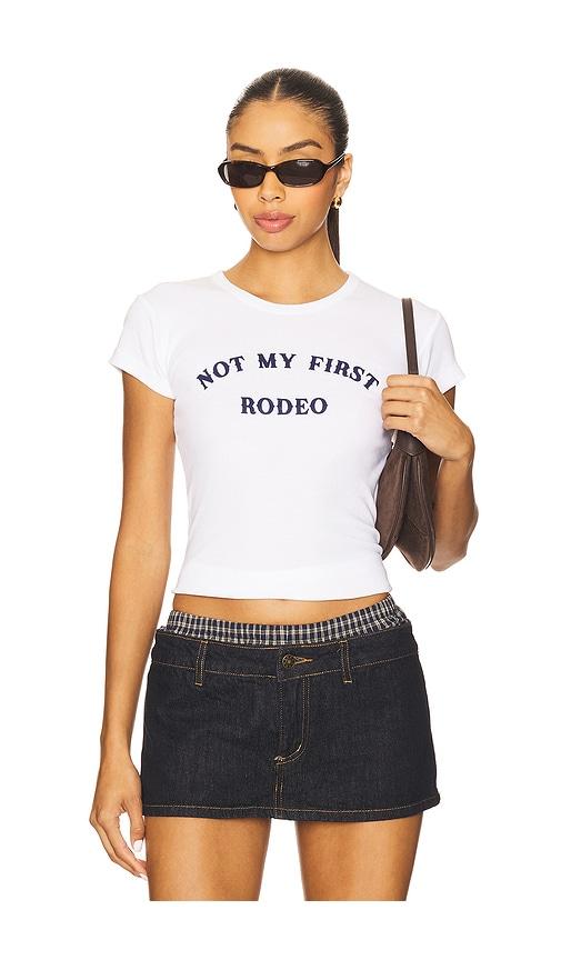 departure not my first rodeo baby tee in white.