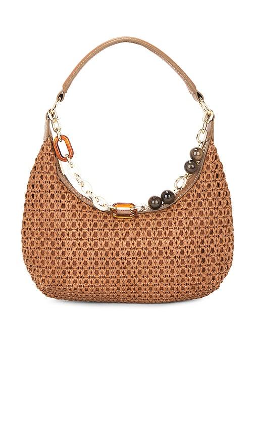dolce vita poppie shoulder bag in tan.
