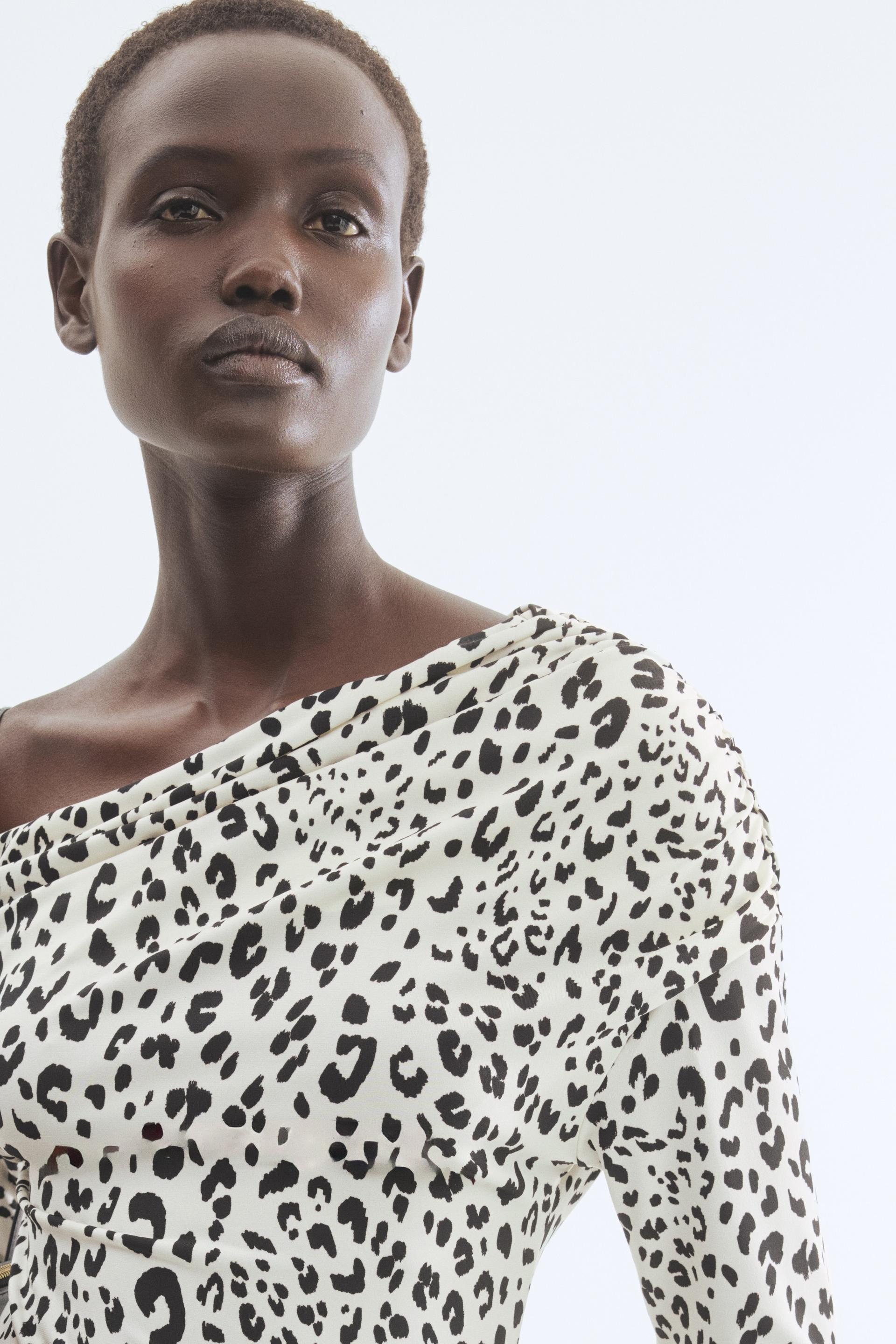 draped one-shoulder top