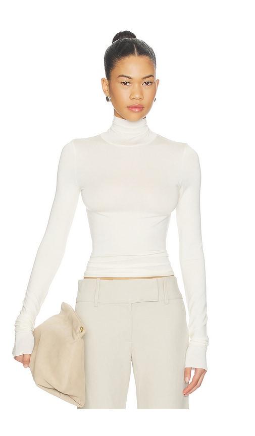 eterne fitted turtleneck top in cream in ivory.