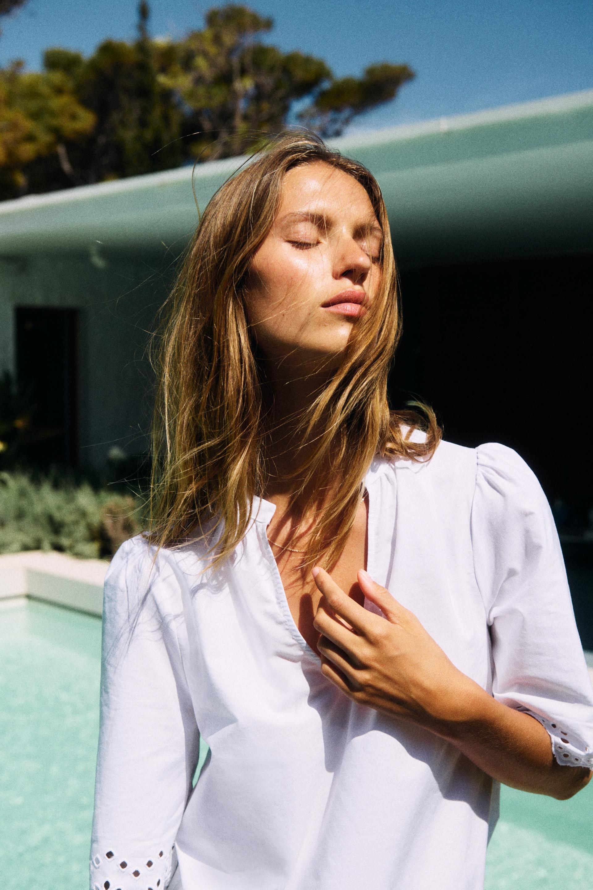 eyelet-embroidered cotton blouse