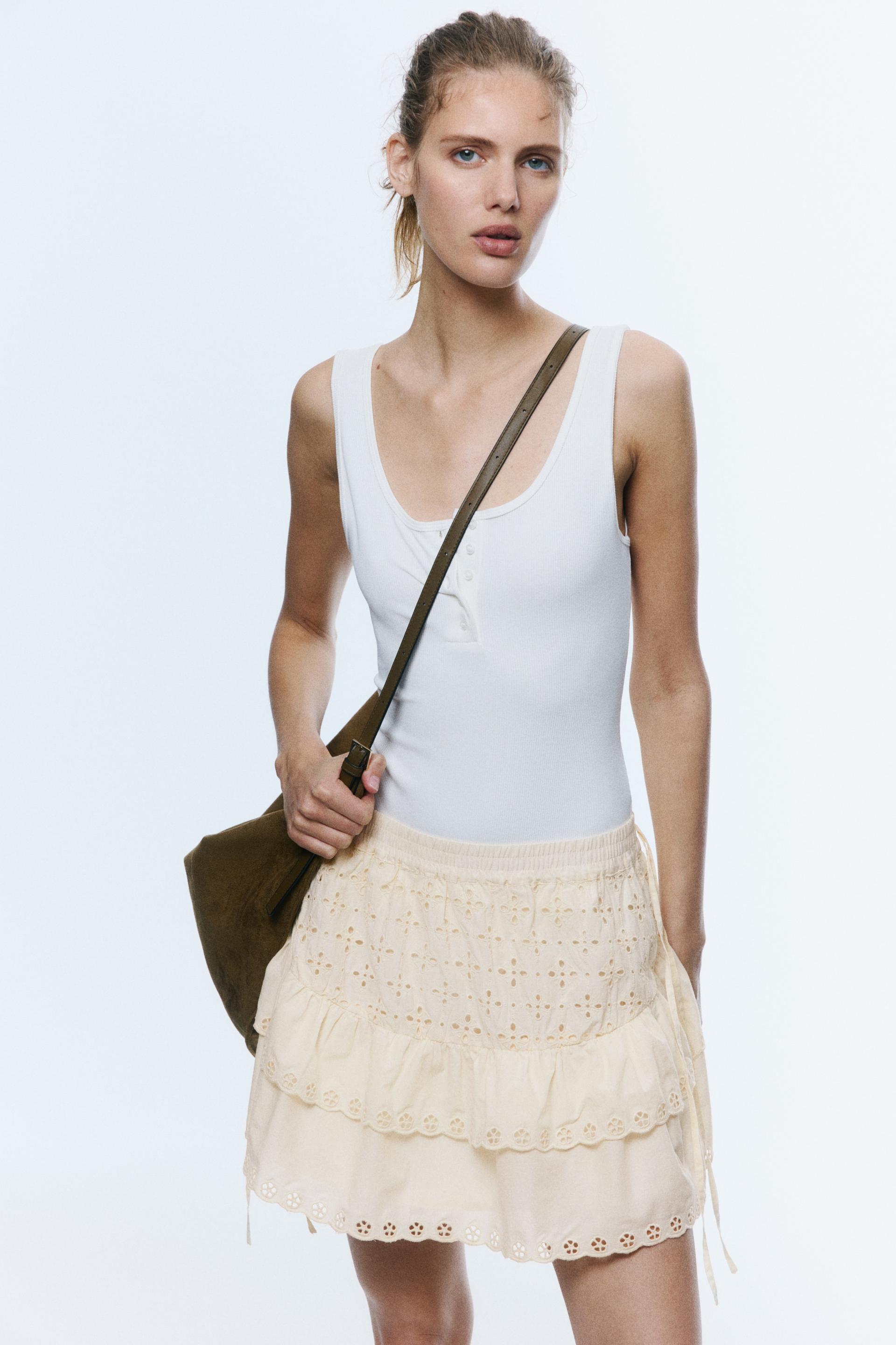 eyelet-embroidered cotton mini skirt