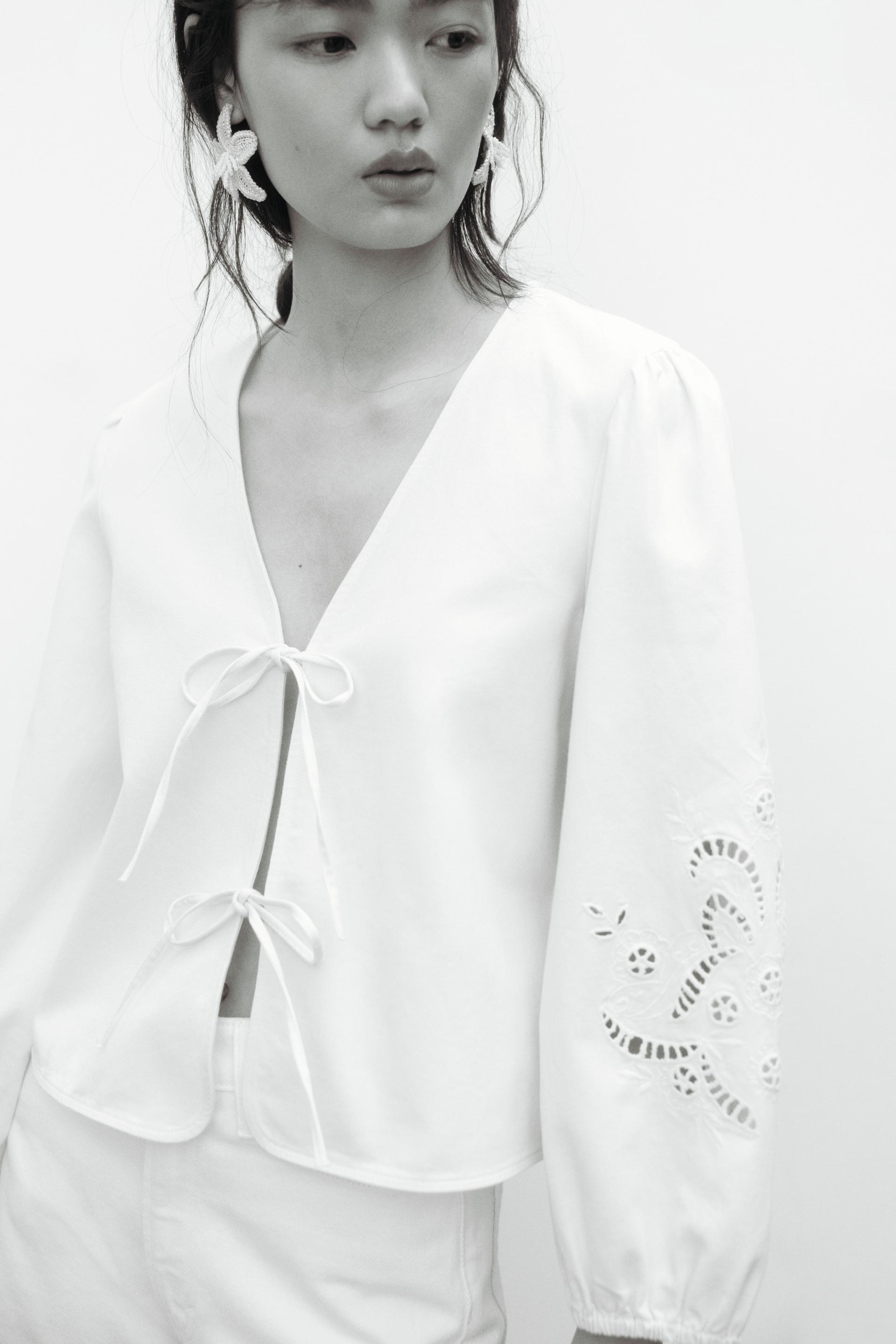 eyelet-embroidered jacket with tie detail
