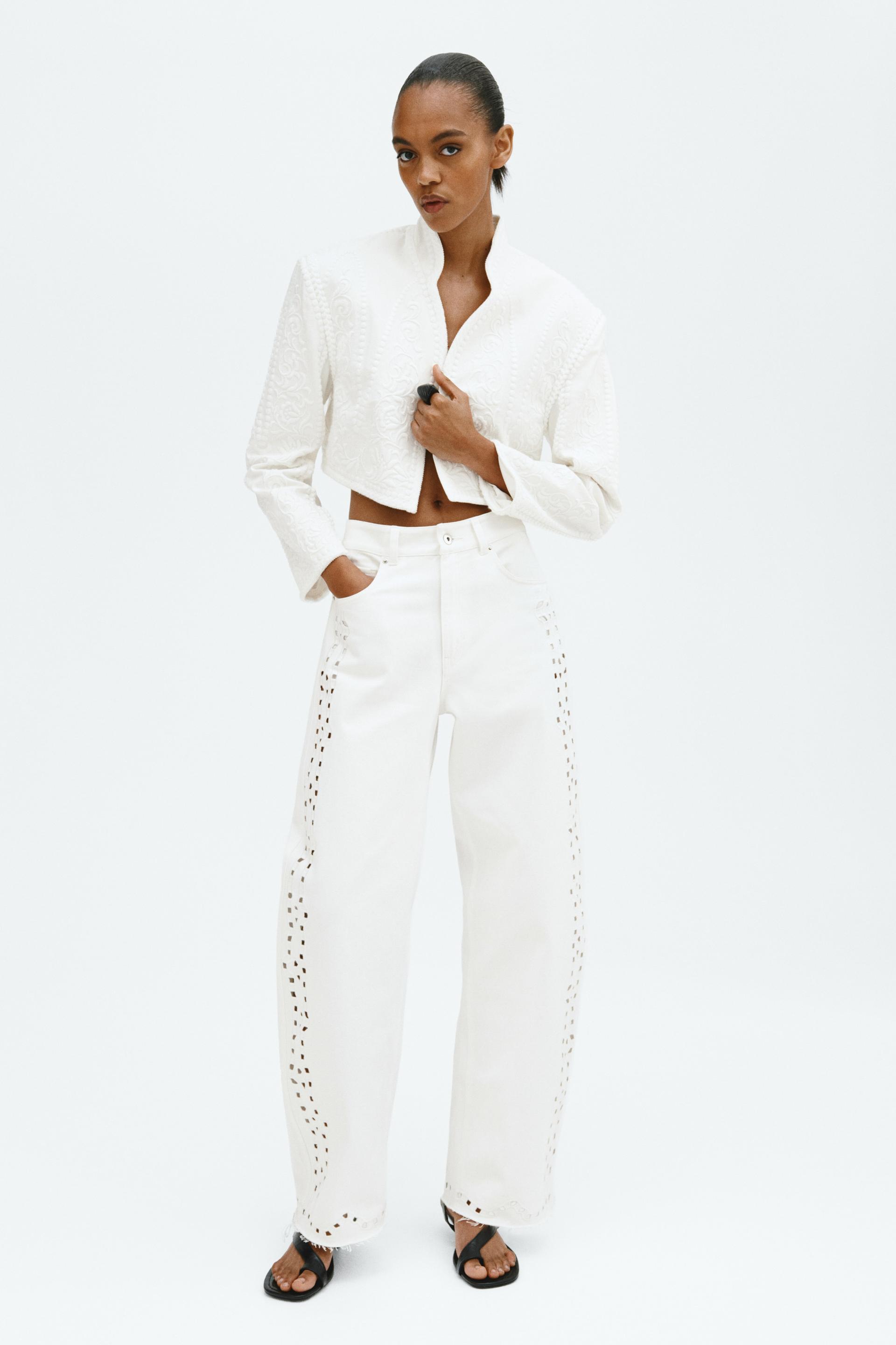 eyelet-embroidered jeans