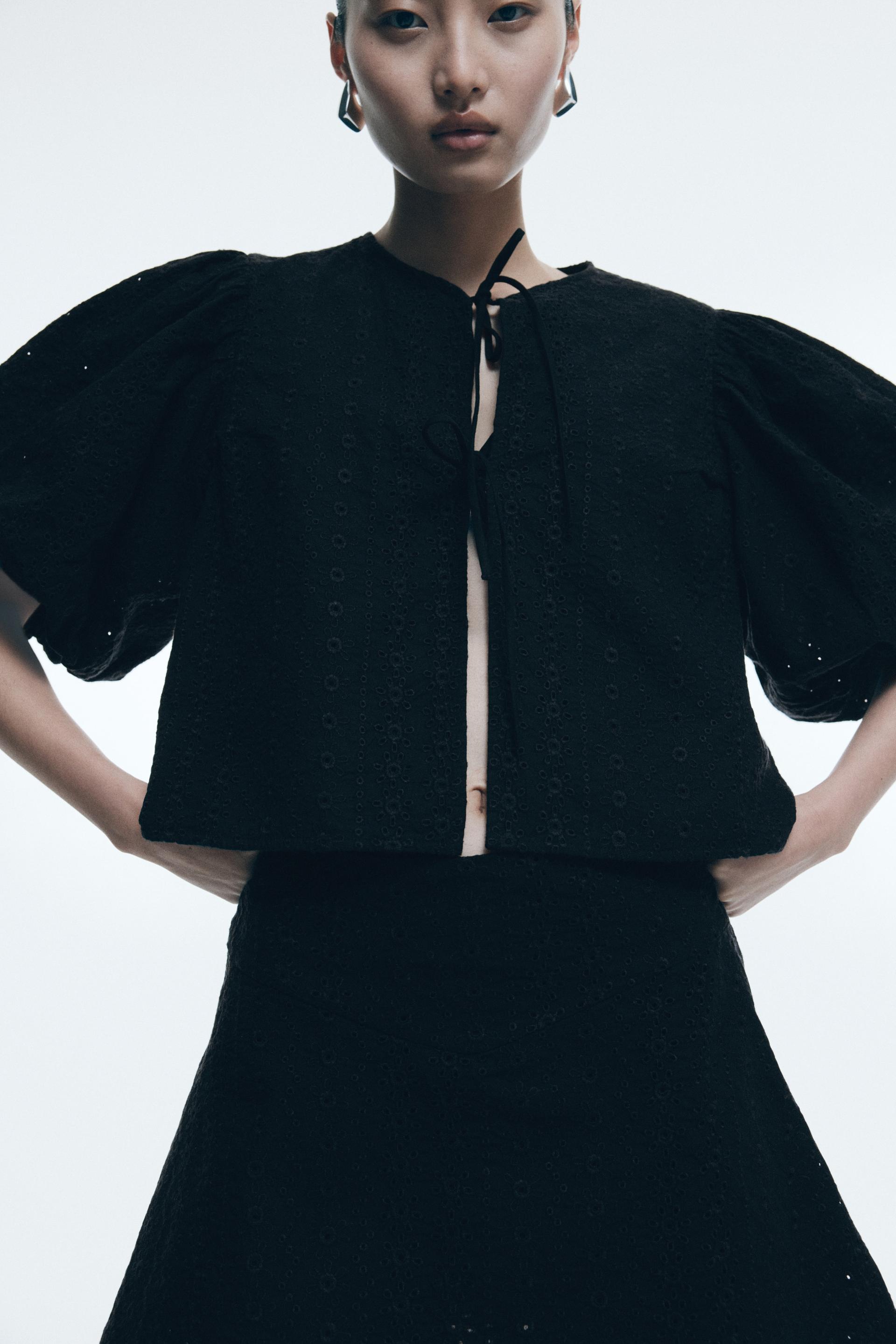 eyelet-embroidered mini skirt