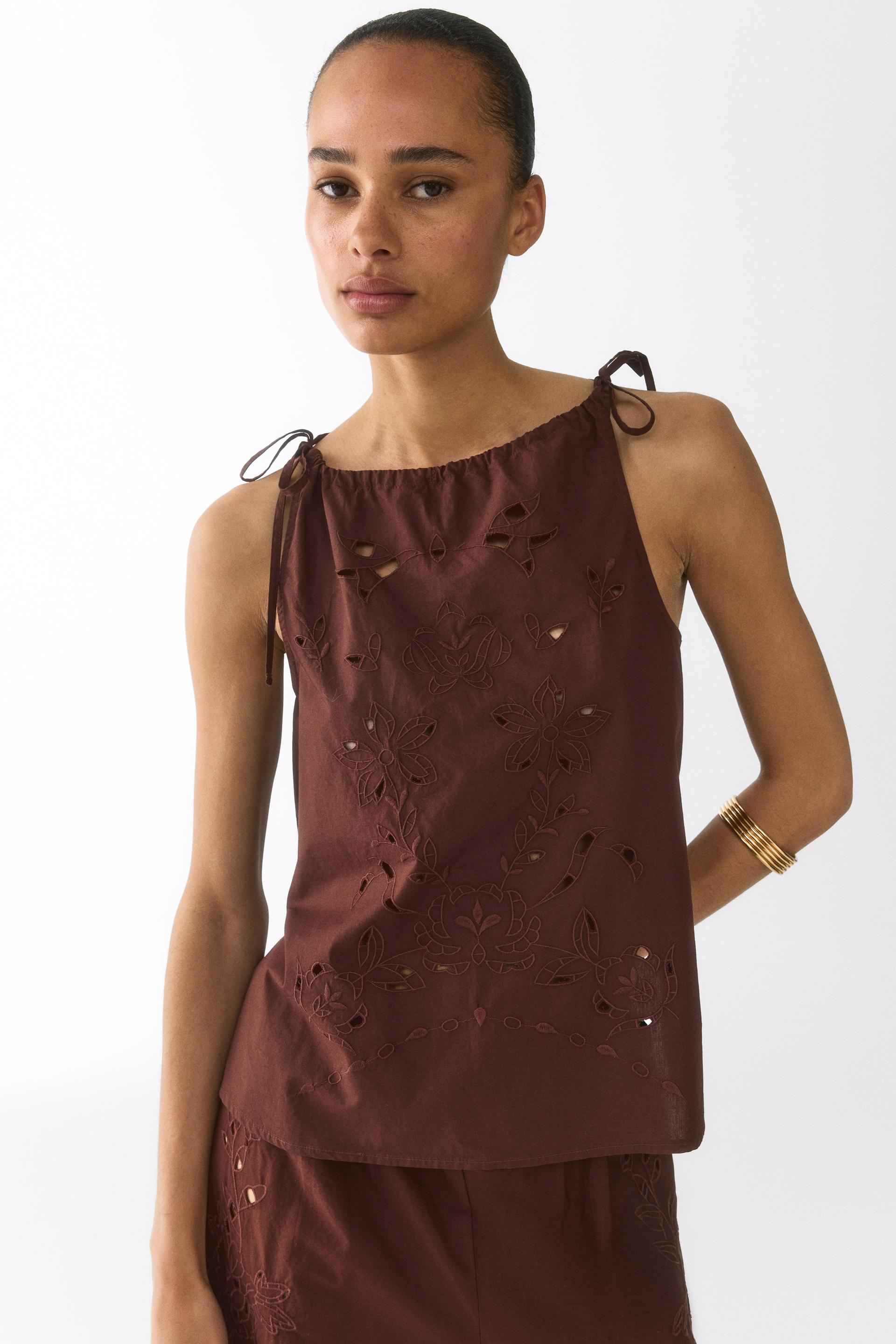 eyelet-embroidered top with tie shoulder straps