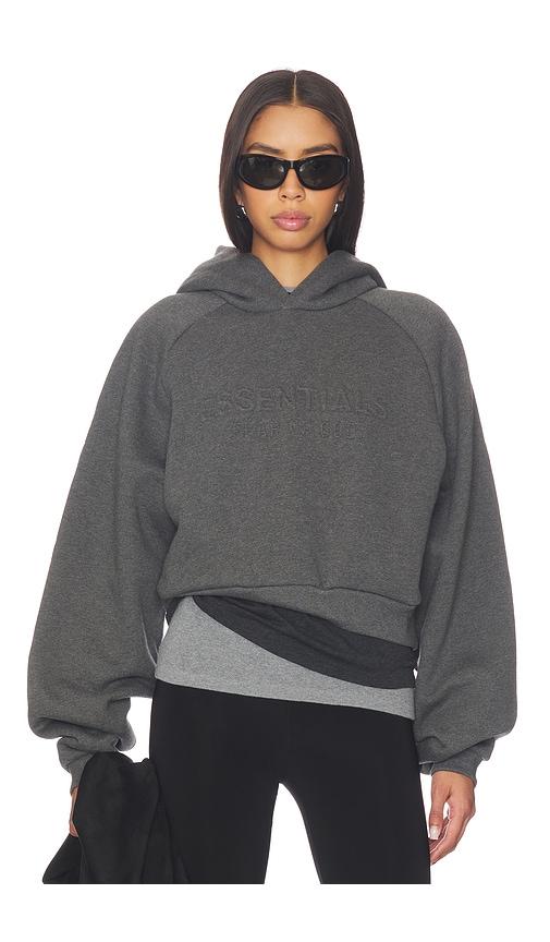 fear of god essentials 90's raglan hoodie in charcoal.