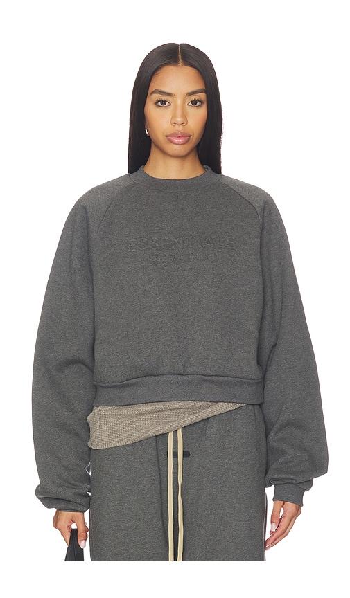 fear of god essentials 90's raglan sweatshirt in charcoal.